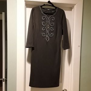Dress with beaded design at neck